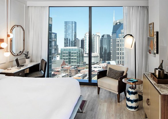 Hotel room overlooking skyscrapers