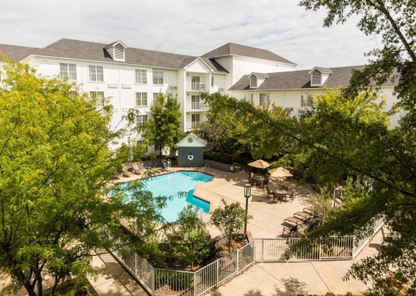 Aerial view of a hotel with swimming pool