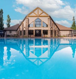 pool with reflection of hotel