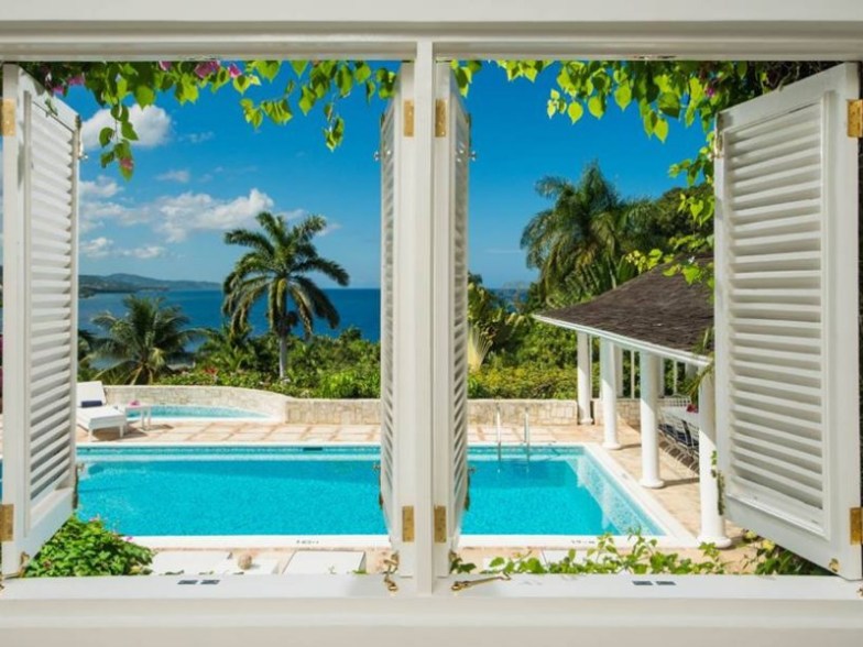 Pool and ocean view at Round Hill Hotel & Villas