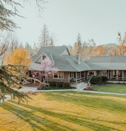 Aerial view of a ranch hotel in a garden
